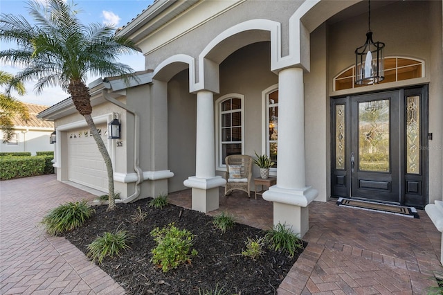 view of exterior entry featuring a garage