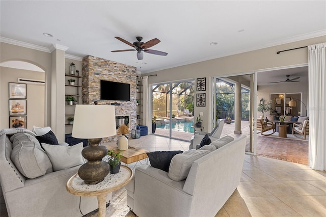 living room with crown molding, ceiling fan, and light tile patterned flooring