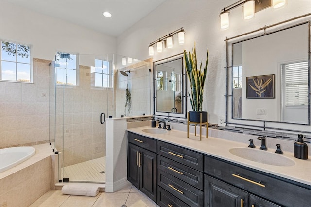 bathroom featuring vanity, separate shower and tub, and tile patterned flooring