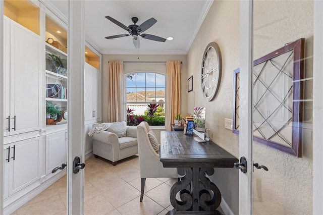 tiled home office featuring ornamental molding and ceiling fan