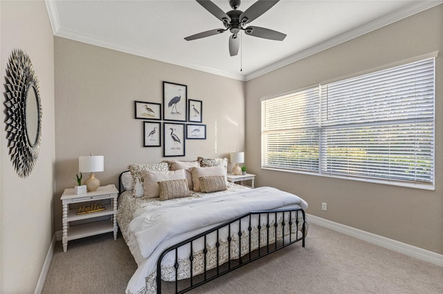 carpeted bedroom with ornamental molding and ceiling fan