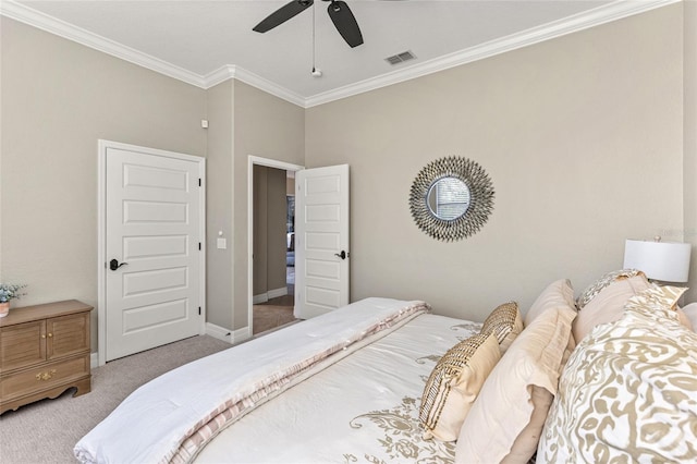 bedroom featuring crown molding, light carpet, and ceiling fan