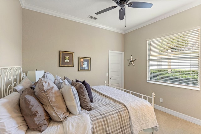 carpeted bedroom featuring crown molding and ceiling fan