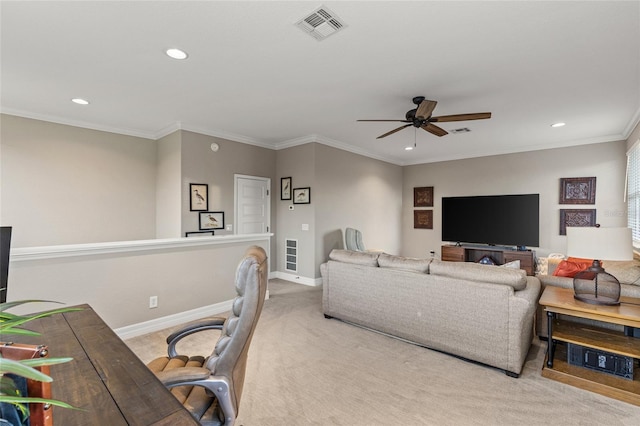 carpeted living room with crown molding and ceiling fan