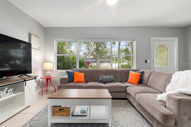 tiled living room featuring ceiling fan