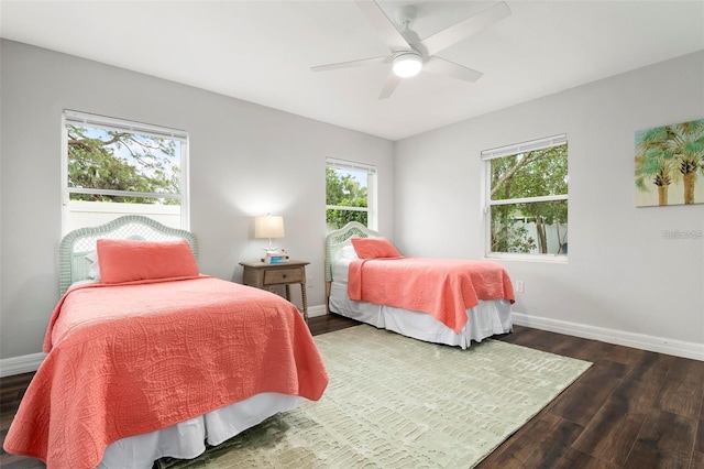 bedroom featuring dark wood-type flooring and ceiling fan