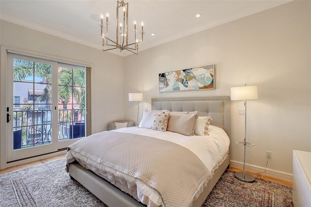 bedroom with crown molding, hardwood / wood-style flooring, a chandelier, and access to outside