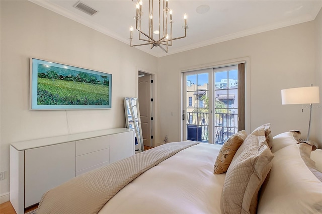 bedroom with access to exterior, crown molding, and a chandelier