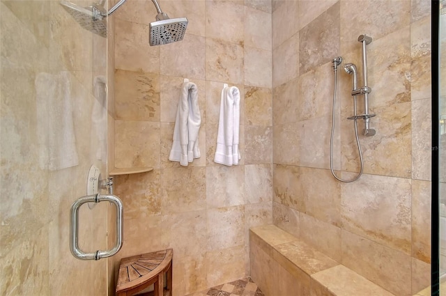 bathroom with a shower with shower door