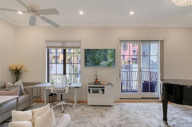 doorway to outside with ceiling fan, ornamental molding, and a wealth of natural light