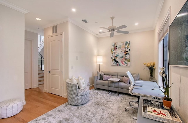 home office with wood-type flooring, ornamental molding, and ceiling fan