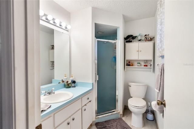 bathroom featuring vanity, toilet, a textured ceiling, and walk in shower