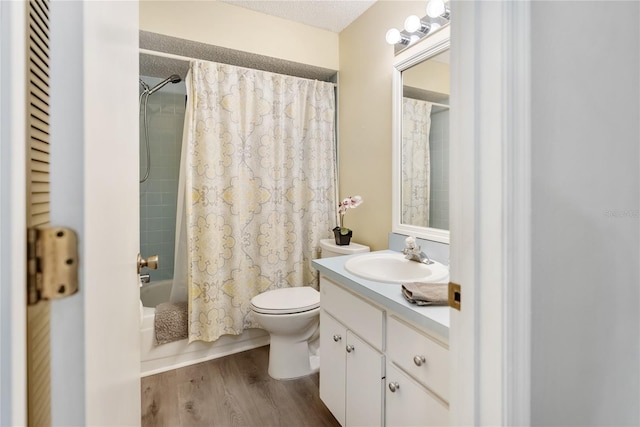 full bathroom featuring vanity, hardwood / wood-style flooring, toilet, and shower / bathtub combination with curtain