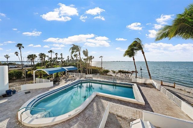 view of pool with a water view