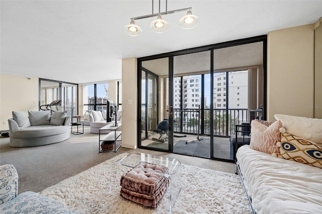 living room featuring a wall of windows and carpet flooring