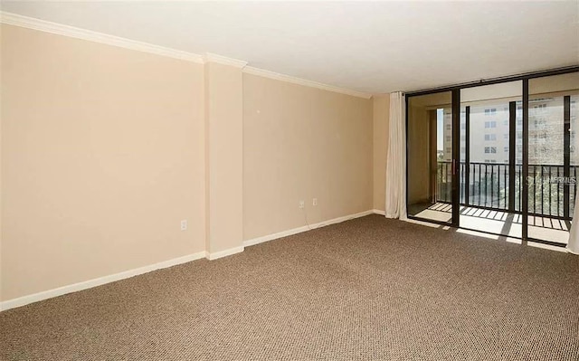 11 Sunset Dr Unit 406, Sarasota, FL 34236 - unfurnished room with a wall of windows, baseboards, dark colored carpet, and ornamental molding