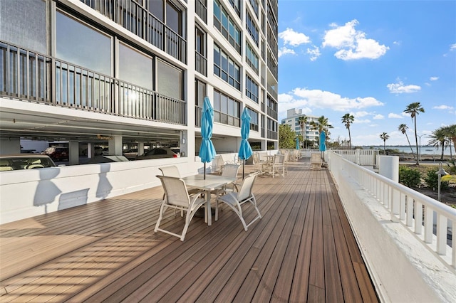 11 Sunset Dr Unit 406, Sarasota, FL 34236 - wooden terrace with outdoor dining space