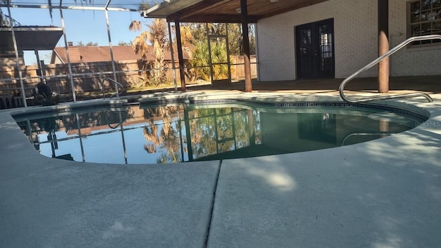 view of pool featuring a lanai and a patio area