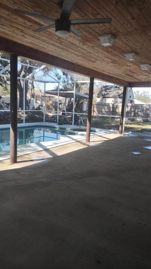 view of patio with a lanai and ceiling fan