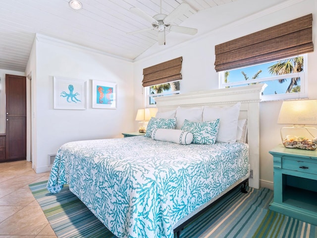 tiled bedroom with crown molding, ceiling fan, lofted ceiling, and wooden ceiling