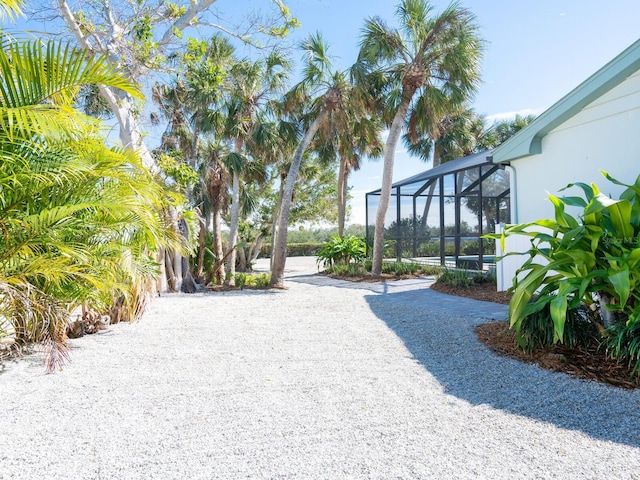 view of yard featuring a lanai