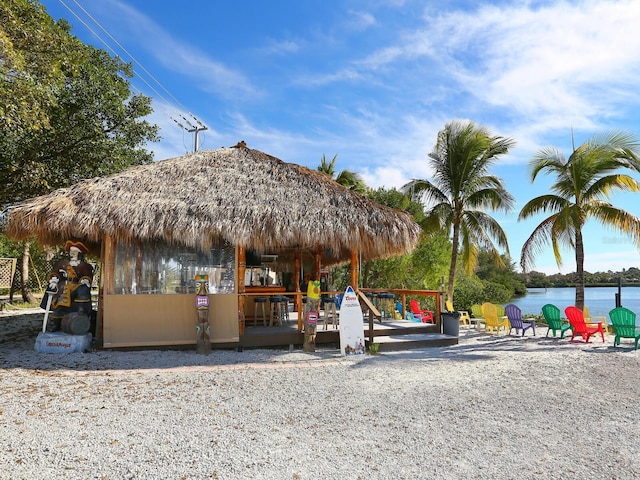 view of jungle gym with a gazebo and a water view