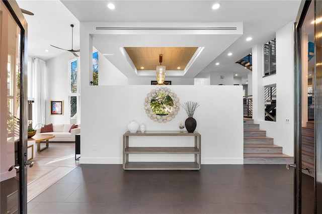 entryway featuring a raised ceiling