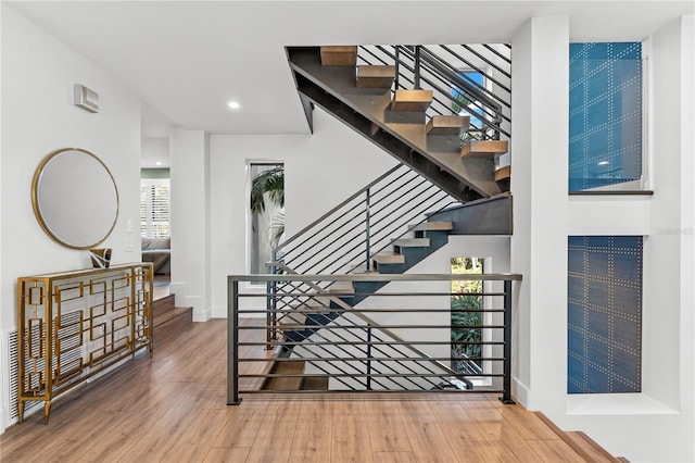 stairway featuring wood-type flooring