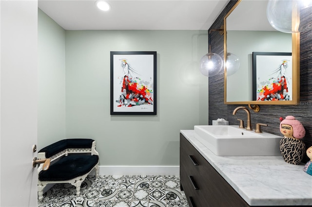 bathroom with tile patterned flooring and vanity