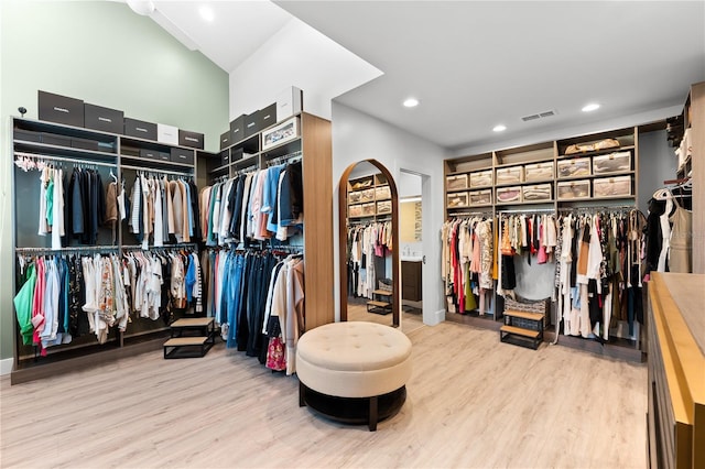 walk in closet featuring light hardwood / wood-style flooring