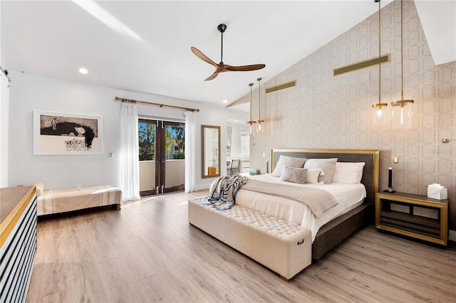 bedroom featuring ceiling fan, vaulted ceiling, hardwood / wood-style floors, and access to outside