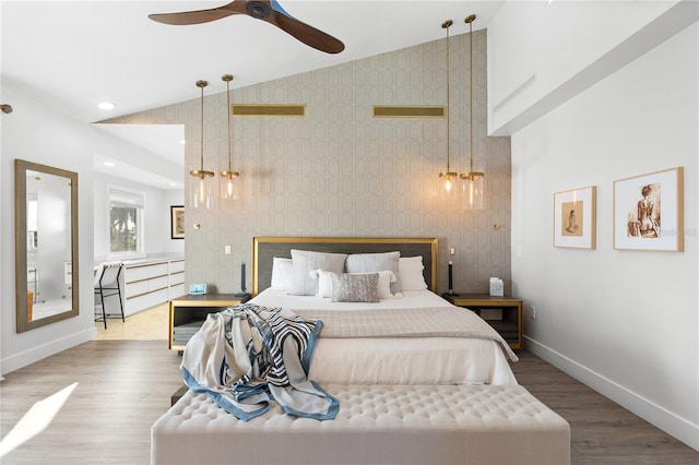 bedroom featuring hardwood / wood-style flooring and high vaulted ceiling