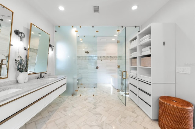 bathroom with vanity and a shower with shower door