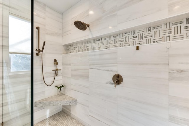 bathroom with tiled shower