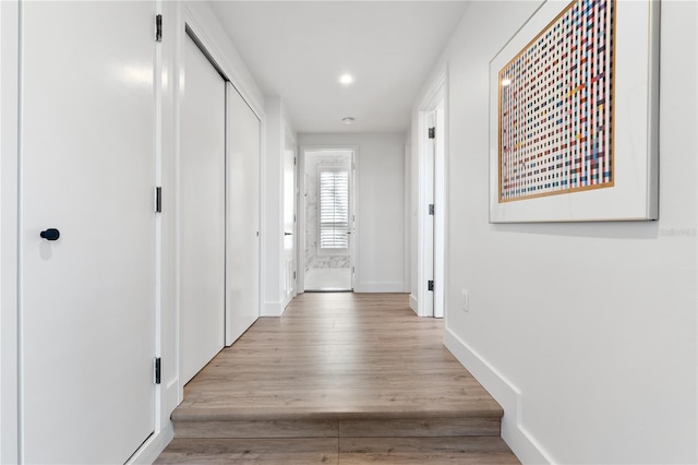 corridor featuring light hardwood / wood-style floors