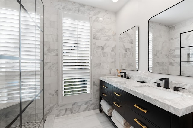 bathroom with vanity and tile walls