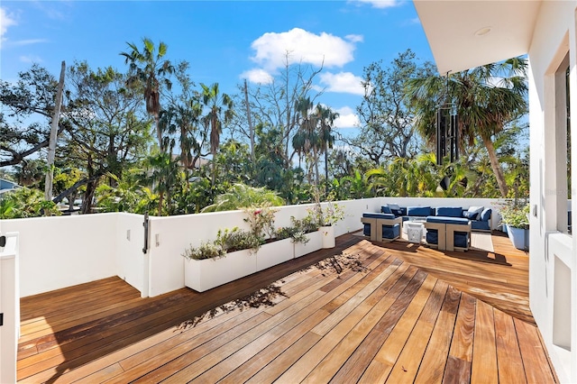 wooden deck with an outdoor hangout area