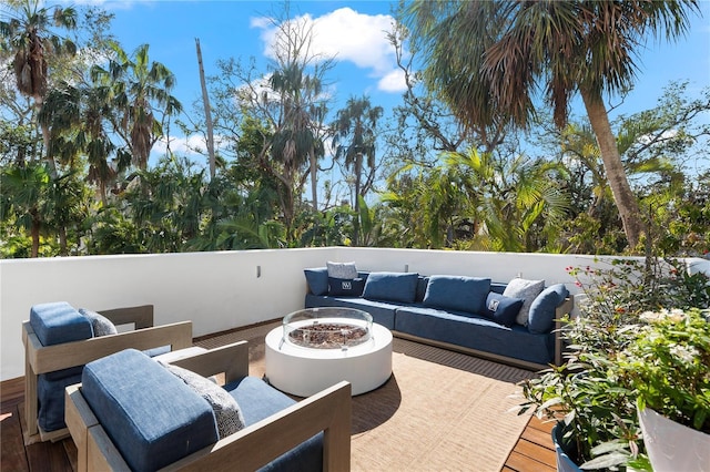 view of patio / terrace with an outdoor living space with a fire pit