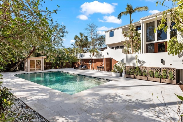 view of swimming pool with a patio area