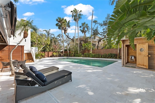 view of swimming pool with a patio