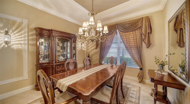 dining space featuring a raised ceiling, light tile patterned flooring, crown molding, and an inviting chandelier