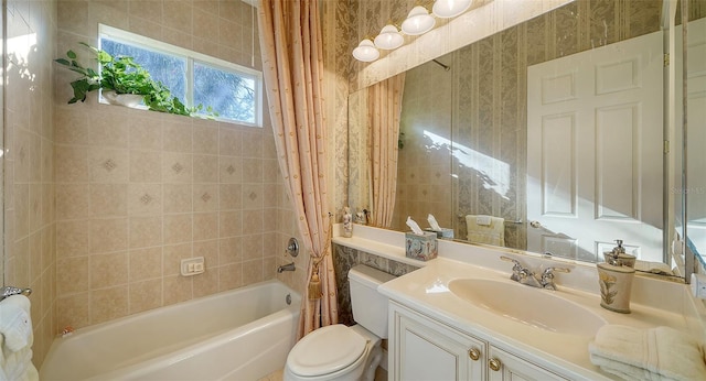 full bathroom featuring vanity, toilet, and shower / tub combo