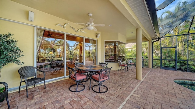 sunroom featuring ceiling fan