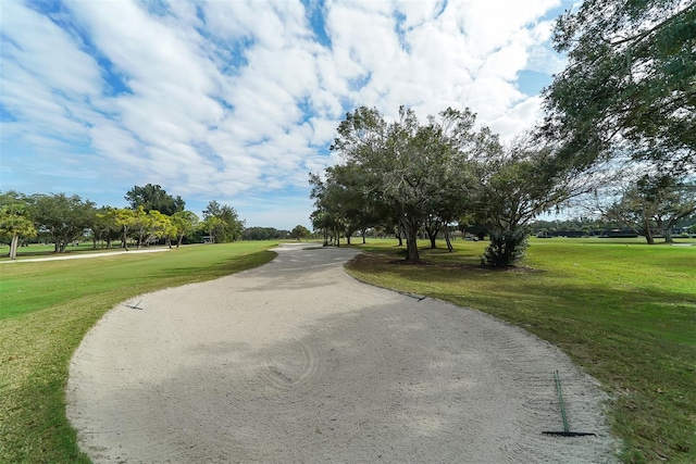 surrounding community featuring a yard