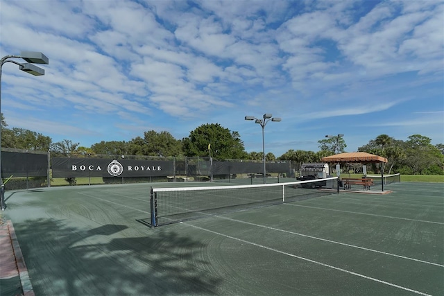 view of tennis court with a gazebo