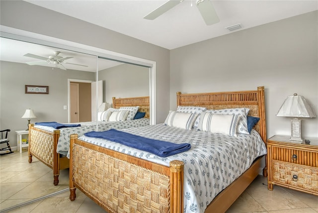 tiled bedroom featuring a closet and ceiling fan