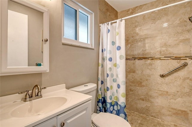 bathroom featuring vanity, toilet, and a shower with shower curtain