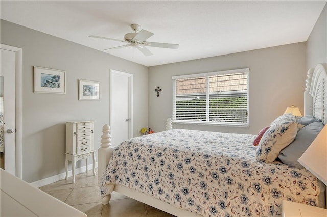 bedroom featuring light tile patterned floors and ceiling fan