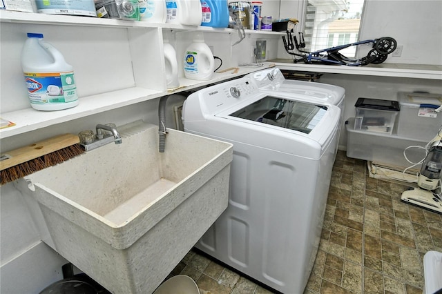 laundry area with independent washer and dryer