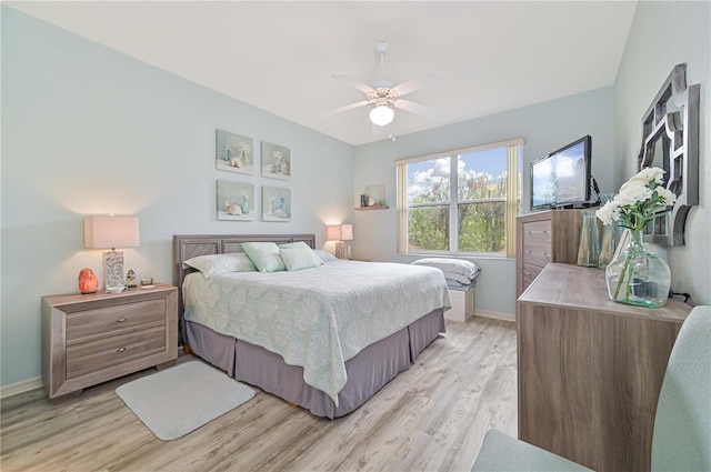 bedroom with ceiling fan and light hardwood / wood-style floors